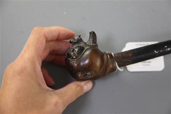 A Victorian rhinoceros horn handled mastiff walking stick, late 19th century, the handle 2.25in. high